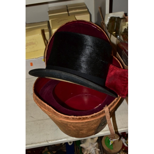 746 - A LEATHER TOP HAT BOX (dent to side), containing a Tress & Co London top hat, 8 x 6¼ - signs of wear... 