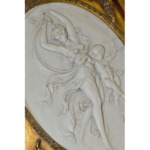 759 - AFTER T.P DANBIERE, two cast marble high relief plaques, oval in shape depicting scantily clad class... 