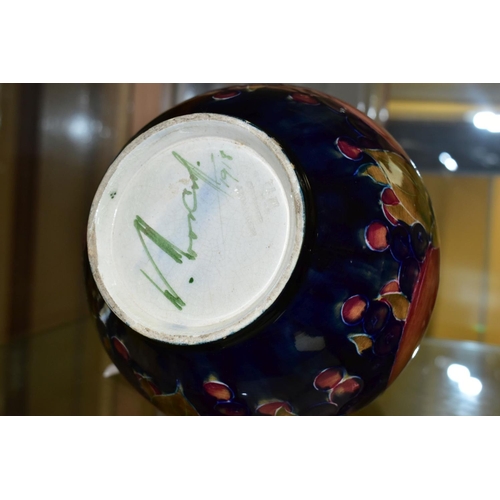 771 - A MOORCROFT POTTERY THREE HANDLED VASE, Pomegranate pattern, signed and dated 1918, height 22cm (Con... 