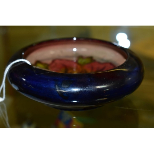 772 - A MOORCROFT POTTERY FLAMBE LIPPED BOWL, Hibiscus pattern, impressed backstamp, diameter inside lip 1... 