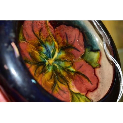 772 - A MOORCROFT POTTERY FLAMBE LIPPED BOWL, Hibiscus pattern, impressed backstamp, diameter inside lip 1... 