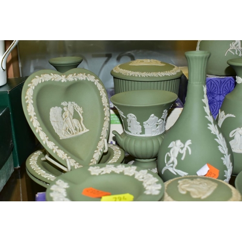 794 - A GROUP OF GREEN WEDGWOOD JASPERWARE, including vases, trinket pots and covers, trinket dishes, a cu... 