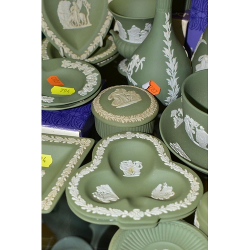 794 - A GROUP OF GREEN WEDGWOOD JASPERWARE, including vases, trinket pots and covers, trinket dishes, a cu... 