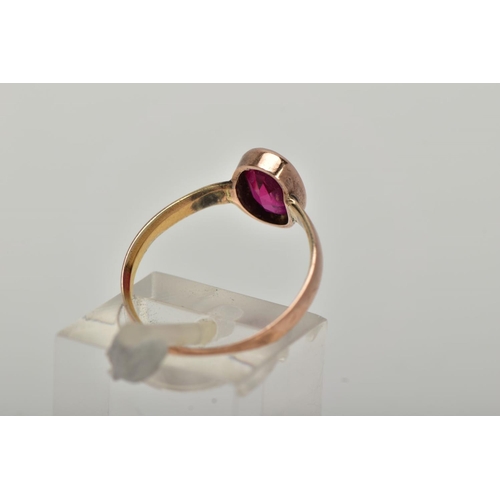 8 - A VICTORIAN YELLOW METAL RING, collet mounted oval cut synthetic ruby,  plain polished band, rubbed ... 