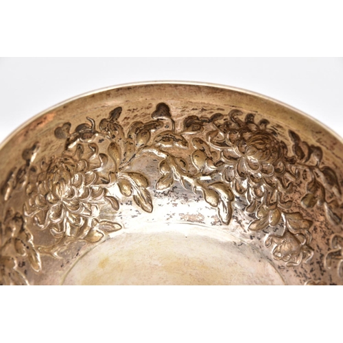 84 - A LATE 19TH/EARLY 20TH CENTURY SHANGHAI SILVER BOWL, embossed floral design on a slightly raised cir... 