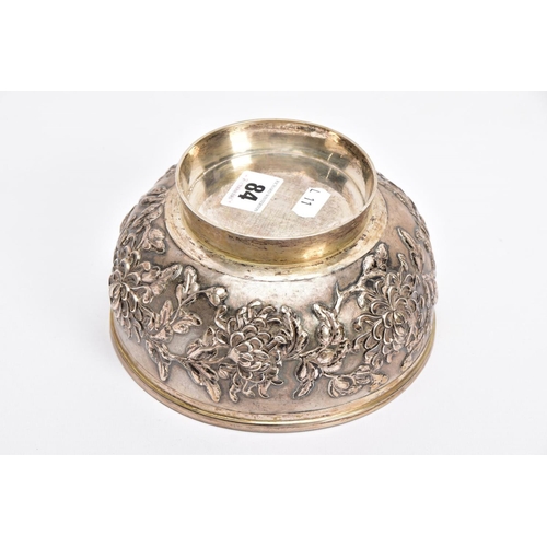 84 - A LATE 19TH/EARLY 20TH CENTURY SHANGHAI SILVER BOWL, embossed floral design on a slightly raised cir... 