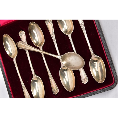 85 - A CASED SET OF EARLY 20TH CENTURY SILVER TEASPOONS AND CASED SET OF SIX TEASPOONS, each with a flora... 