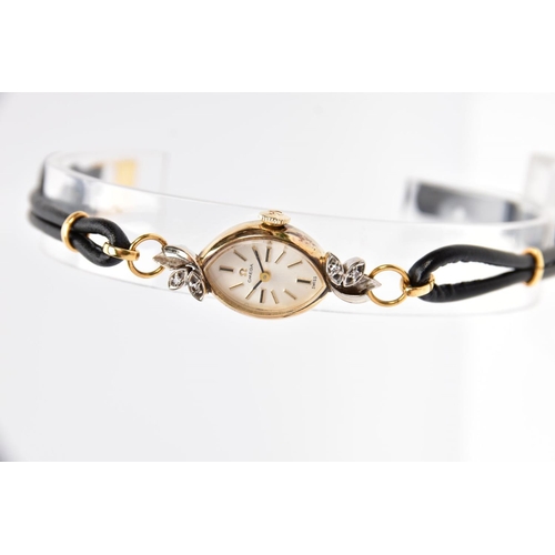 91 - A LADIES OMEGA WRISTWATCH, the marquise shape face with baton hour markers, the outer leaf detail se... 