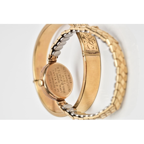 93 - A HINGED BANGLE AND A WRISTWATCH, the hinged bangle with engraved scrolling acanthus leaf decoration... 