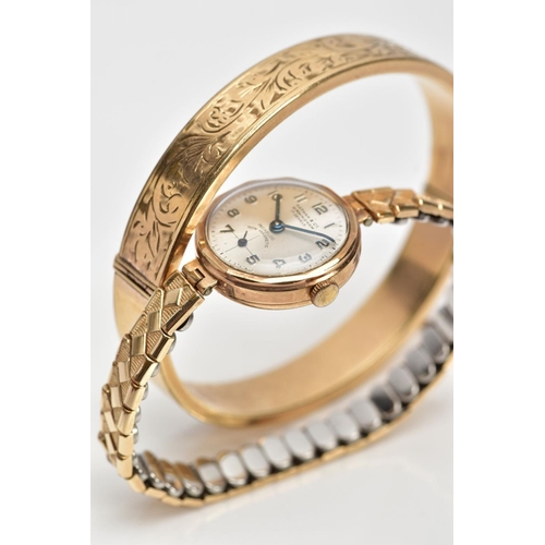 93 - A HINGED BANGLE AND A WRISTWATCH, the hinged bangle with engraved scrolling acanthus leaf decoration... 