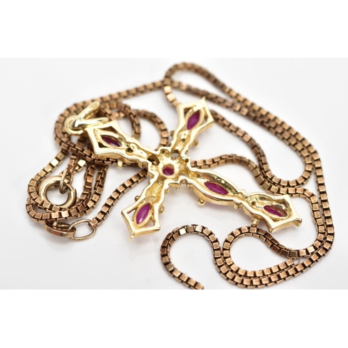 97 - A 9CT GOLD RUBY AND DIAMOND PENDANT AND CHAIN, the cross pendant set with five marquise shape rubies... 