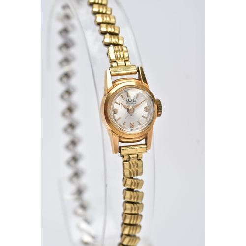 99 - A WRISTWATCH, the Mu Du wristwatch with 18ct gold head and gold plated expandable strap, with 18ct i... 