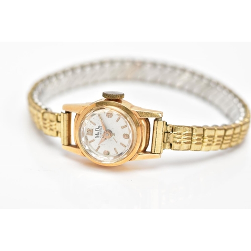 99 - A WRISTWATCH, the Mu Du wristwatch with 18ct gold head and gold plated expandable strap, with 18ct i... 