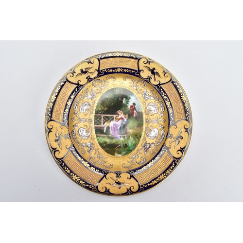 40A - A VIENNA PORCELAIN CABINET PLATE, handpainted with a courting couple within an enamelled and jewelle... 