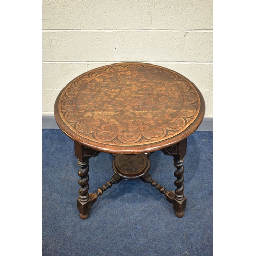 45A - A 1920'S CIRCULAR CARVED OAK CENTRE TABLE, on angled barley twist legs united by bobbin turned stret... 