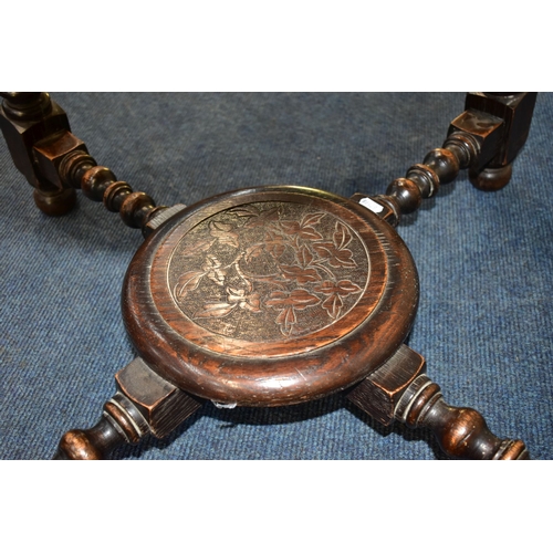 45A - A 1920'S CIRCULAR CARVED OAK CENTRE TABLE, on angled barley twist legs united by bobbin turned stret... 