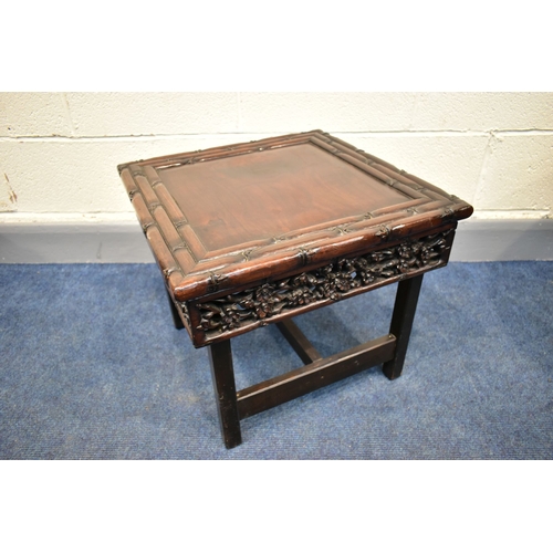 50A - A CHINESE CARVED HARDWOOD OCCASIONAL TABLE, carved faux bamboo top surmounting a frieze of carved pr... 