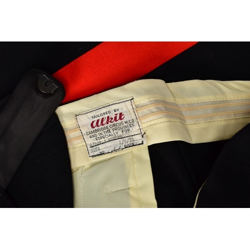 105 - AN OFFICERS MESS DRESS EVENING WEAR SUIT, three piece jacket, waistcoat and trousers, black with red... 