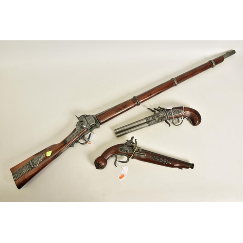 114 - THREE WHITE METAL COPIES OF ANTIQUE FIREARMS, the first is a copy of a Miquelet flintlock pistol hav... 