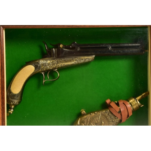 129 - A NEATLY FRAMED DISPLAY CASE containing a cast metal replica of a Collette Gravity pistol, together ... 