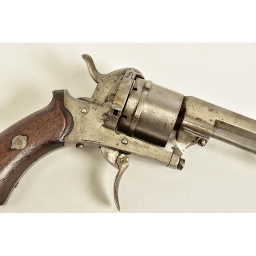 130 - A 7MM PIN-FIRE POCKET REVOLVER fitted with a folding trigger, it is fitted with a two piece set of w... 
