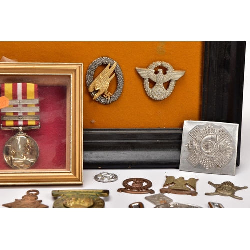 88 - A LARGE FRAME OF OVER THIRTY FIVE MISCELLANEOUS MILITARY CAP BADGES including North Staffs, RAC, RAF... 