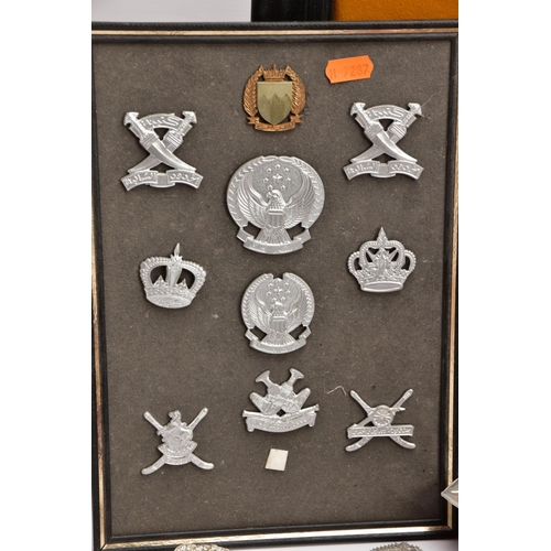 88 - A LARGE FRAME OF OVER THIRTY FIVE MISCELLANEOUS MILITARY CAP BADGES including North Staffs, RAC, RAF... 