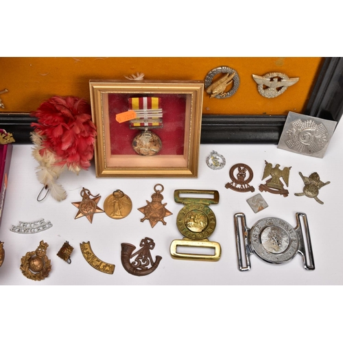 88 - A LARGE FRAME OF OVER THIRTY FIVE MISCELLANEOUS MILITARY CAP BADGES including North Staffs, RAC, RAF... 