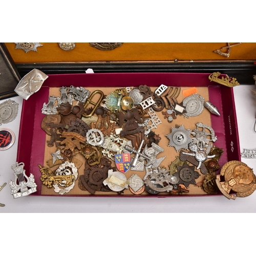 88 - A LARGE FRAME OF OVER THIRTY FIVE MISCELLANEOUS MILITARY CAP BADGES including North Staffs, RAC, RAF... 
