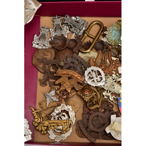 88 - A LARGE FRAME OF OVER THIRTY FIVE MISCELLANEOUS MILITARY CAP BADGES including North Staffs, RAC, RAF... 