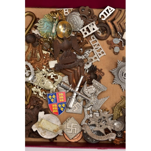 88 - A LARGE FRAME OF OVER THIRTY FIVE MISCELLANEOUS MILITARY CAP BADGES including North Staffs, RAC, RAF... 