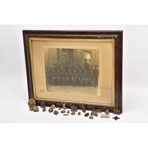 91 - A LARGE GLAZED FRAME WITH A WWI PERIOD PHOTO OF A COMPANY OF SOLDIERS, in uniform, believed RAMC, to... 