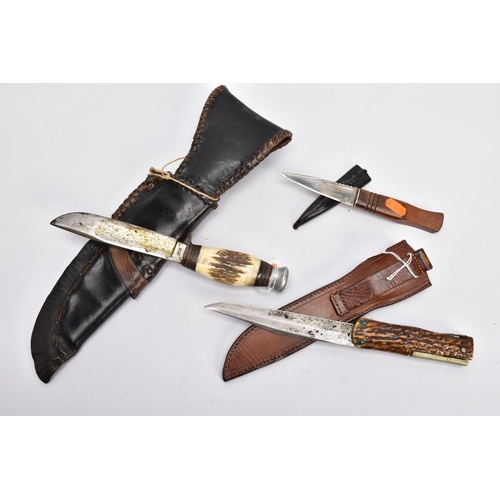 98 - A BOX CONTAINING TWO CAMPING STYLE KNIVES AND SCABBARDS fake bone handles, etc and a Scottish 'Sgian... 