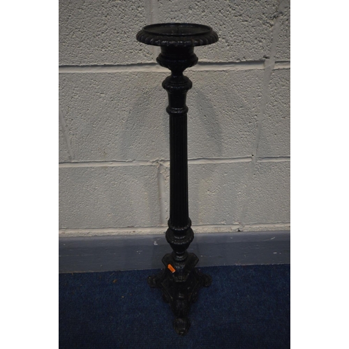 1386 - A BLACK PAINTED CAST IRON CANDLE STAND, height 70cm