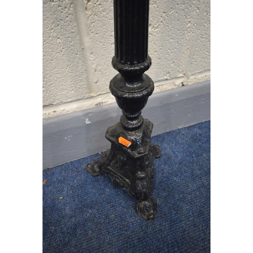 1386 - A BLACK PAINTED CAST IRON CANDLE STAND, height 70cm