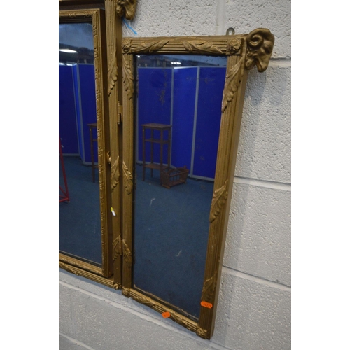 1394 - A LATE 19TH CENTURY GILT WOOD TRIPLE MIRROR, with rams head decoration, the central mirror that swin... 