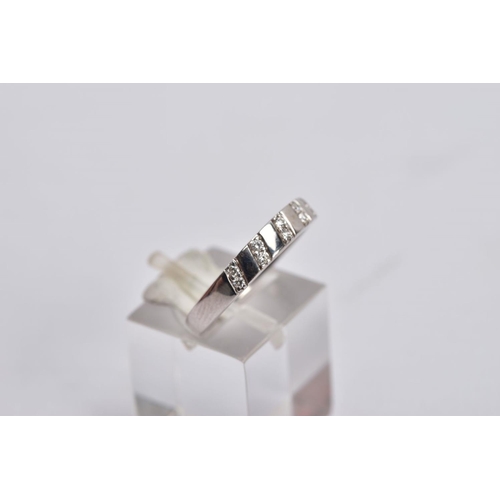 23 - TWO 9CT GOLD DIAMOND RINGS, the first of a half eternity design, set with a row of graduated channel... 