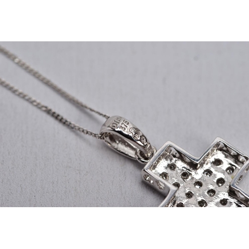 24 - A 9CT WHITE GOLD DIAMOND SET PENDANT NECKLACE, the pendant in the form of a cross, set with single c... 