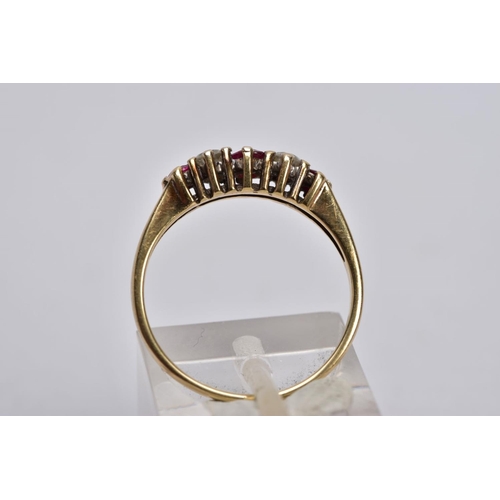 25 - A 9CT GOLD RUBY AND DIAMOND RING, designed with three graduated circular cut rubies, interspaced wit... 