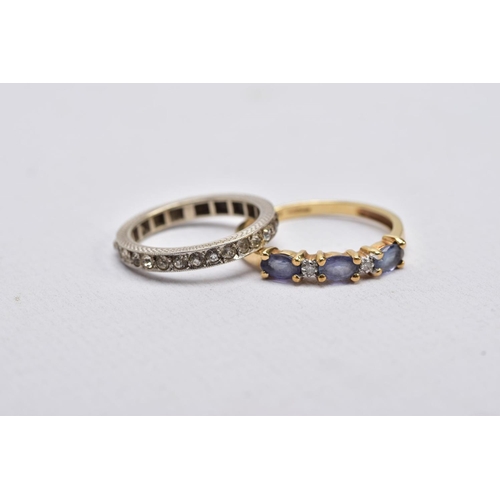 29 - A 9CT GOLD IOLITE AND DIAMOND RING AND A FULL ETERNITY RING, the first designed with three oval cut ... 