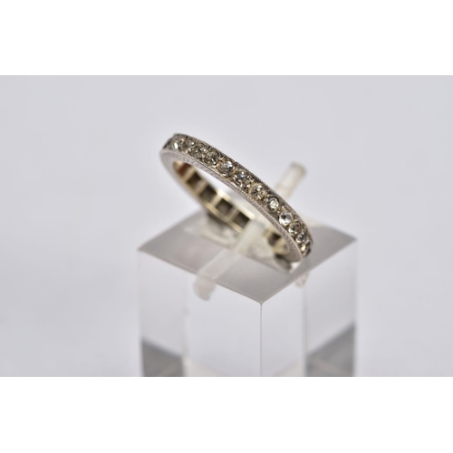 29 - A 9CT GOLD IOLITE AND DIAMOND RING AND A FULL ETERNITY RING, the first designed with three oval cut ... 