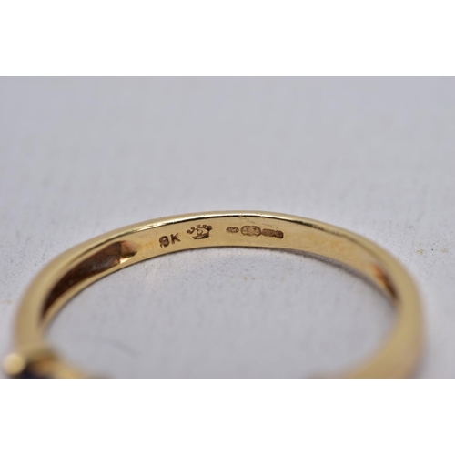 29 - A 9CT GOLD IOLITE AND DIAMOND RING AND A FULL ETERNITY RING, the first designed with three oval cut ... 