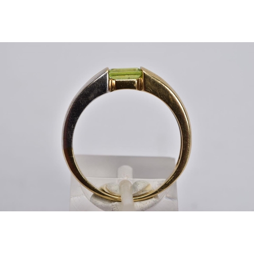 34 - A 9CT GOLD DIAMOND RING AND A 9CT GOLD PERIDOT RING, the first ring designed with a raised illusion ... 