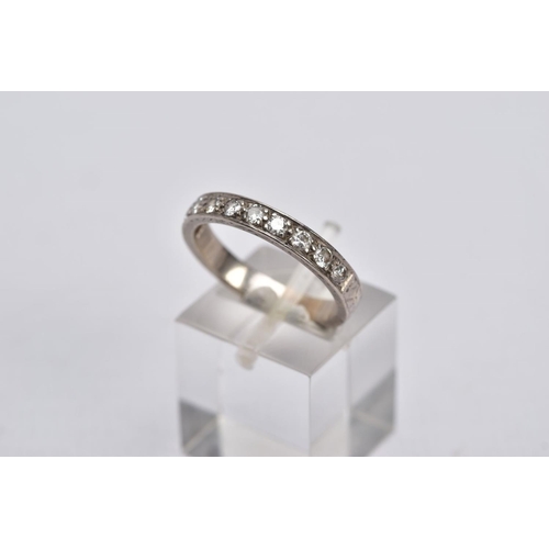 37 - A WHITE METAL DIAMOND HALF ETERNITY RING, designed with a row of ten round brilliant cut diamonds, t... 