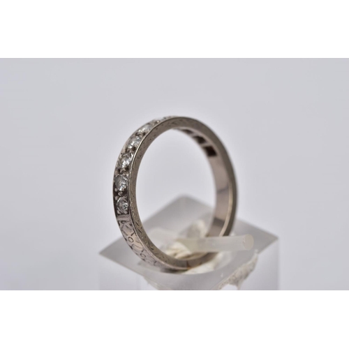 37 - A WHITE METAL DIAMOND HALF ETERNITY RING, designed with a row of ten round brilliant cut diamonds, t... 