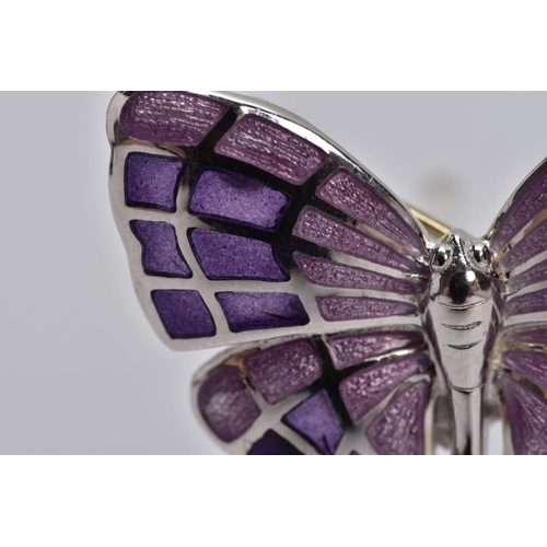 40 - A WHITE METAL ENAMELLED BUTTERFLY BROOCH, designed with purple guilloche enamelled wings, fitted wit... 