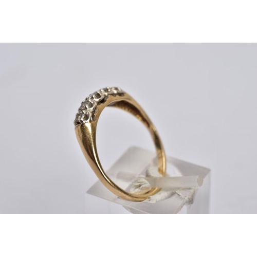 39 - A YELLOW METAL DIAMOND RING, designed with a row of five claw set, round brilliant cut diamonds, tot... 