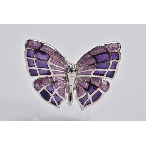 40 - A WHITE METAL ENAMELLED BUTTERFLY BROOCH, designed with purple guilloche enamelled wings, fitted wit... 