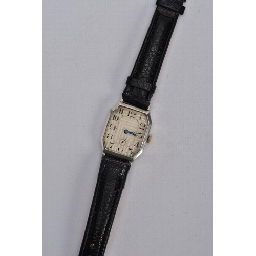 47 - A GENTS EARLY 20TH CENTURY SILVER WRISTWATCH, AF watch with a rectangular engine turned silver dial ... 