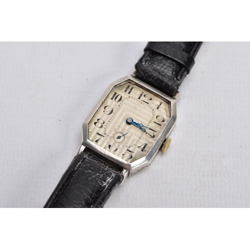 47 - A GENTS EARLY 20TH CENTURY SILVER WRISTWATCH, AF watch with a rectangular engine turned silver dial ... 